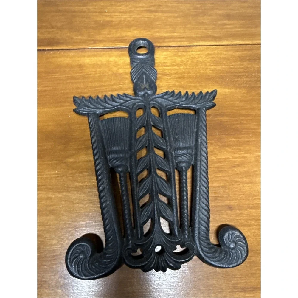 Vtg VM Tassel & Broom  Pennsylvania Dutch Style Cast Iron Trivet 8 5/8